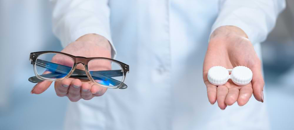 Hobart optometrist offering a patient the choice between glasses and contact lenses.
